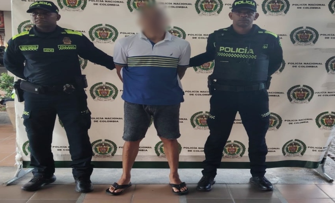 Dos policías y un capturado